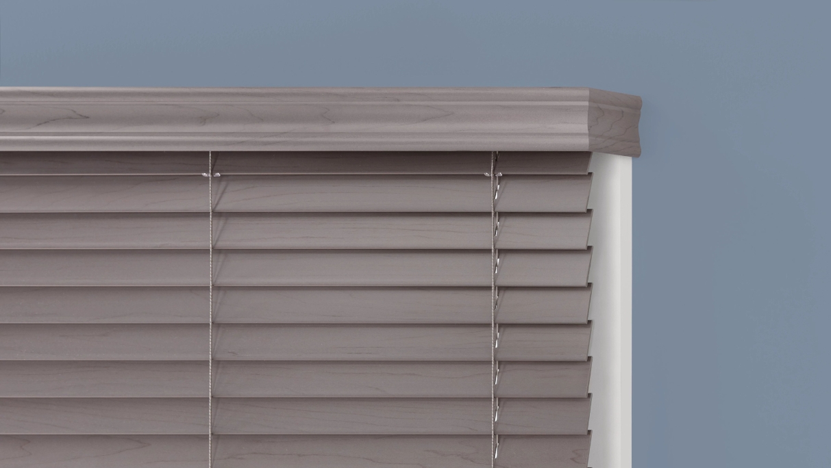 closed crown valance in grey with blinds closed covering window molding in white with blue walls