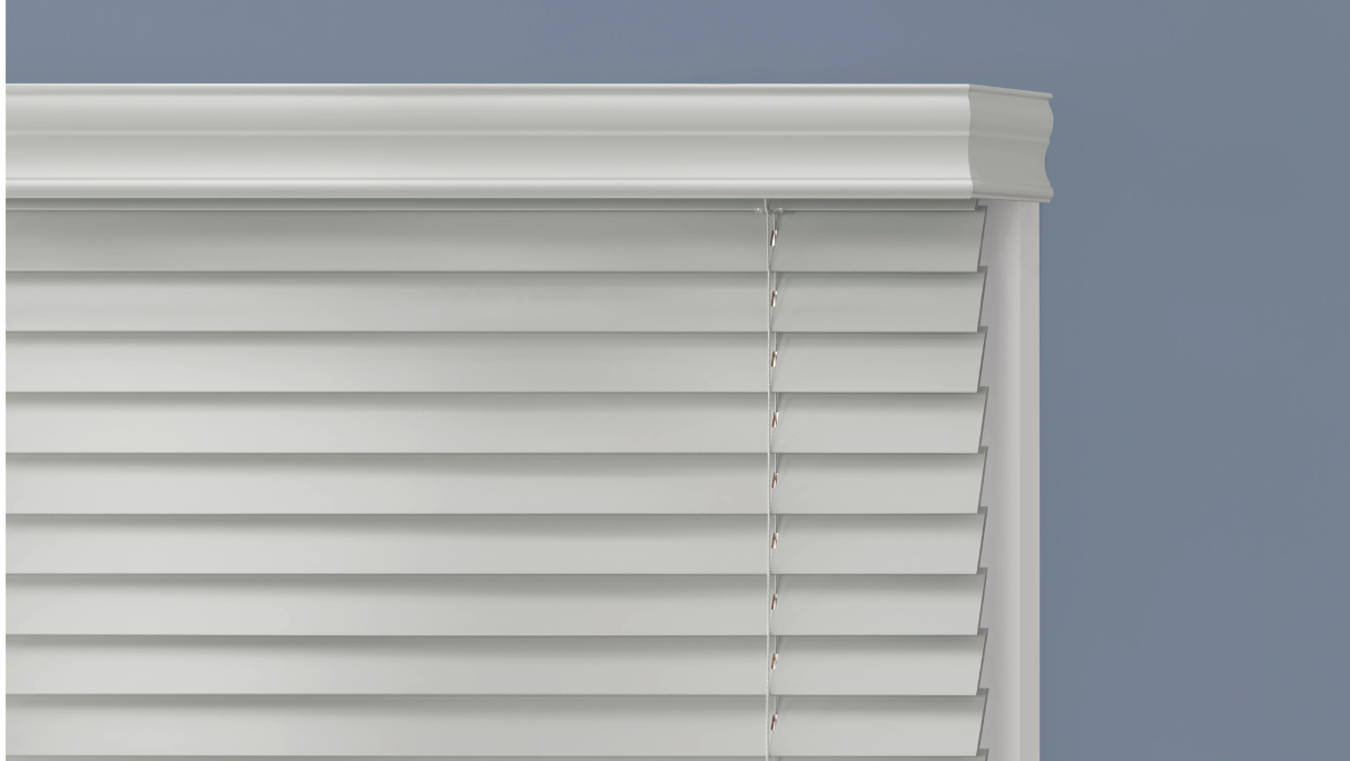 White wood blinds and valance on the outside of the window frame