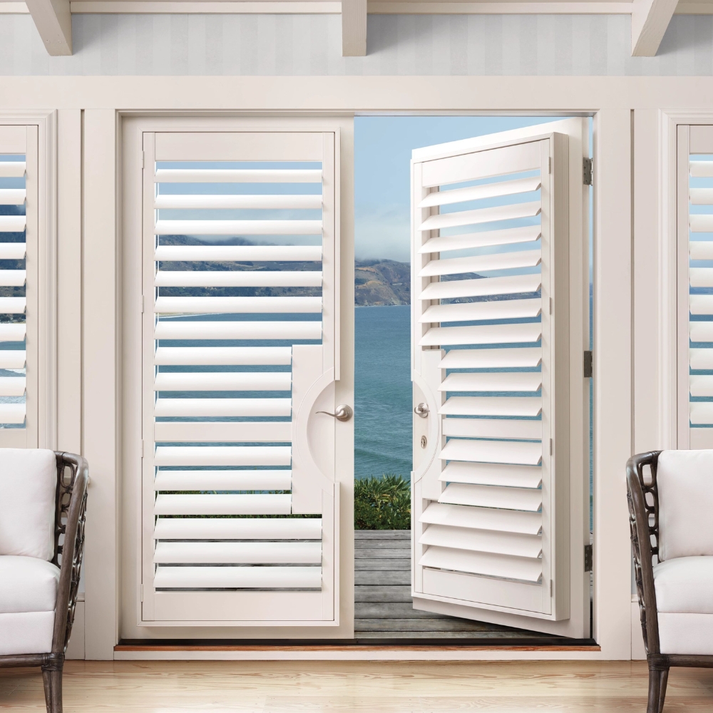 white French Door Shutters with right door partially open to the outside