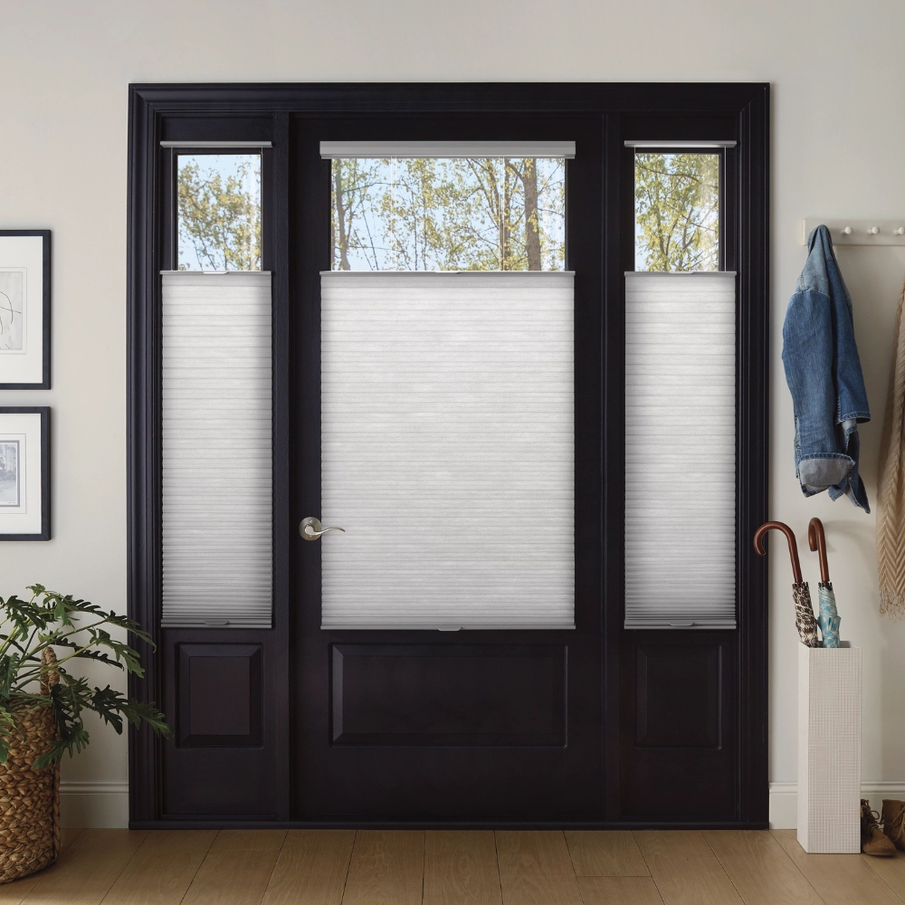 Door and sidelight windows on either side of door with cellular shades 25% open from the top