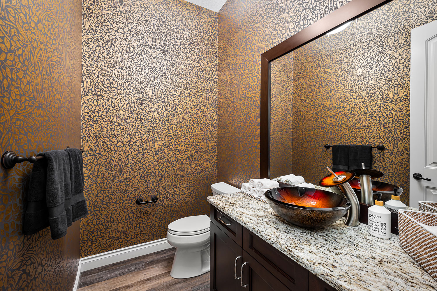 bathroom with wallpaper and basin sink