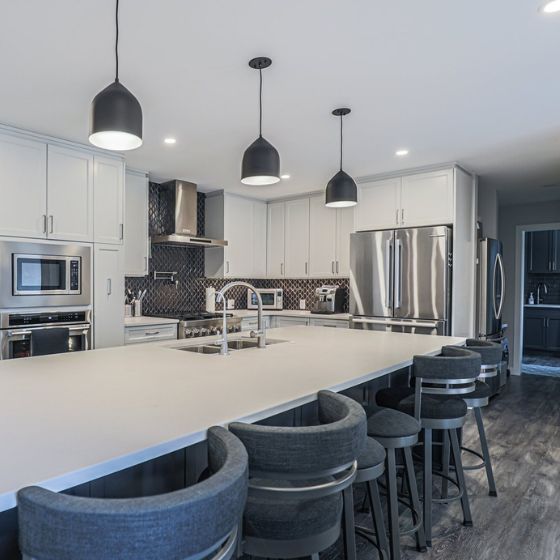 kitchen renovation with eating bar and 3 light pendants