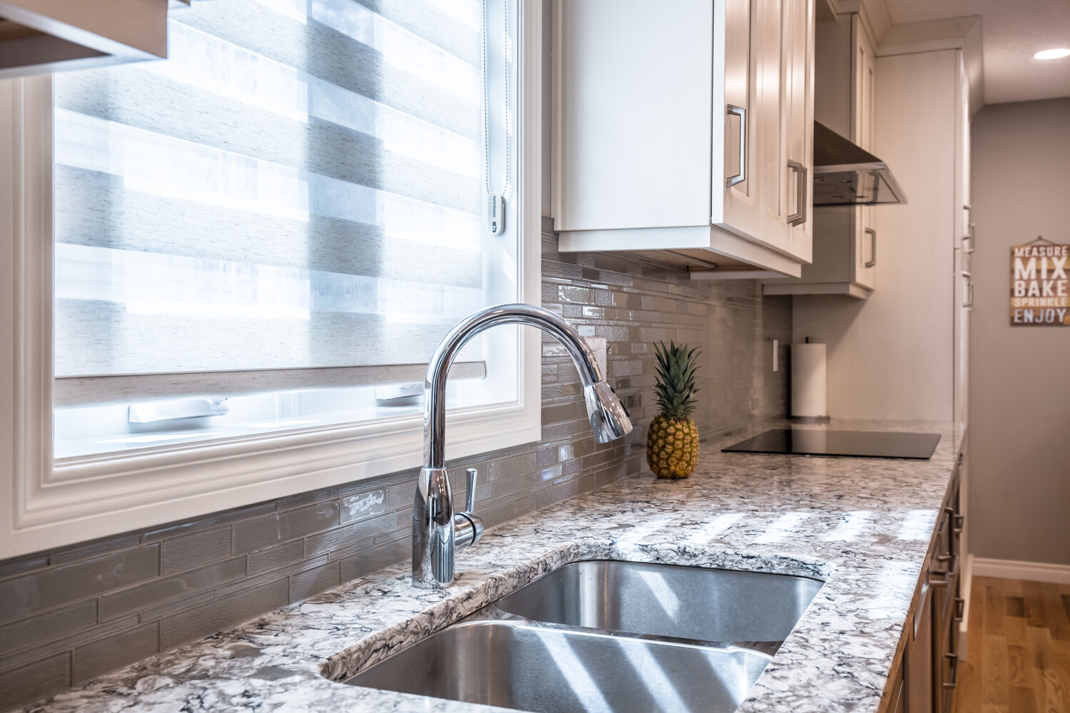 kitchen with banded shade and granite counter top & sink, stove with range