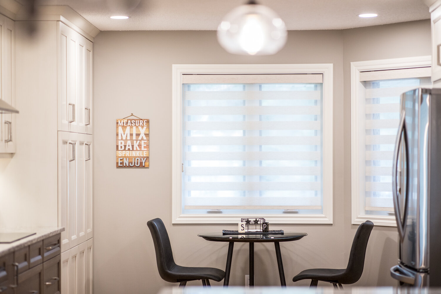 kitchen nook table with banded window shade from Hunter Douglas