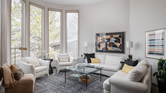 Living room seating with tall windows