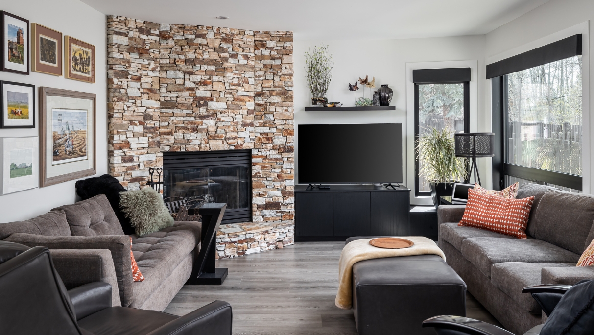 living room with brick fireplace